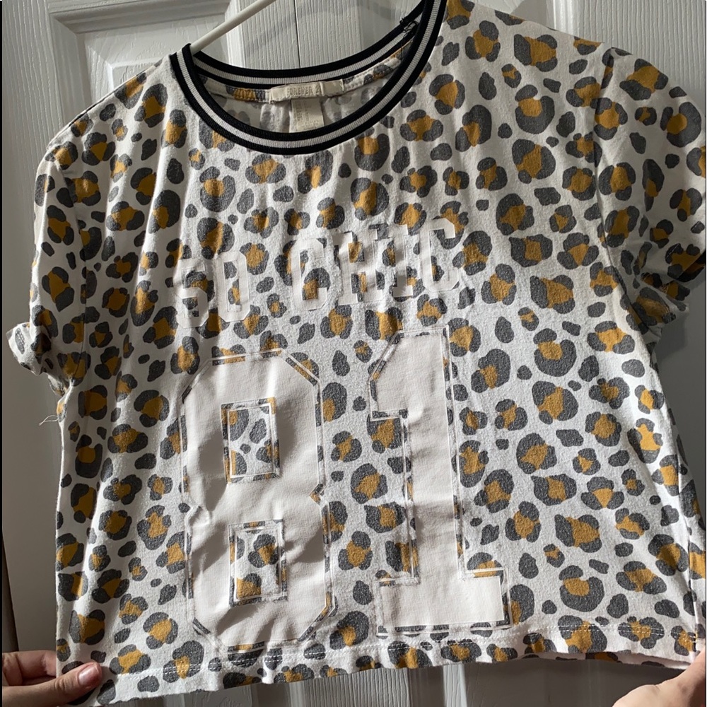 Two cropped graphic tees